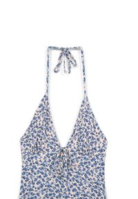 Top a collo alto con motivo floreale in tessuto leggero, caratterizzato da fiori blu su uno sfondo crema, con chiusura a fiocco regolabile e scollatura profonda.
