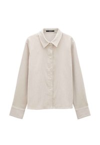Chemise en velours côtelé beige clair avec col, fermeture par bouton, manches longues et rayures verticales texturées. Coupe classique avec ourlet arrondi.