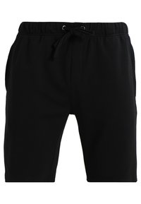 Shorts en coton noir avec une taille élastique à cordon de serrage, poches latérales et une coupe ajustée. Texture lisse et longueur au genou.
