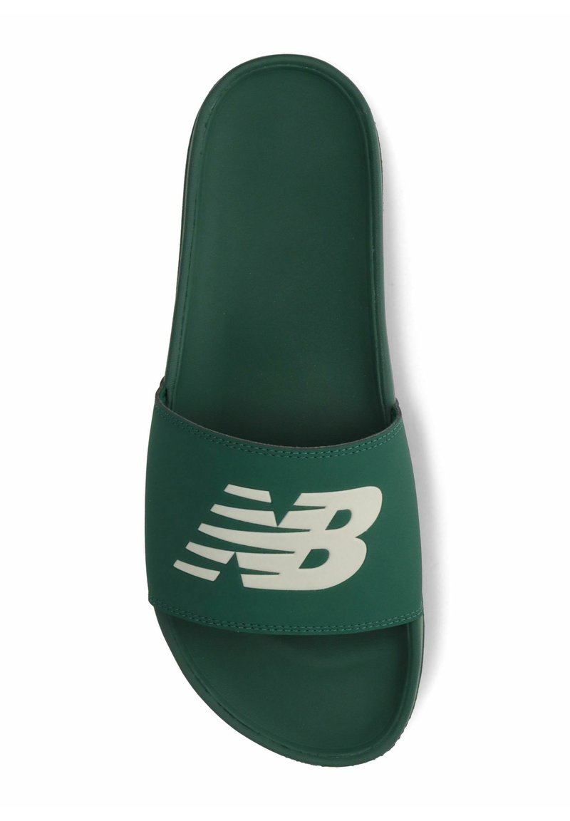Green slide sandal made of synthetic material featuring a wide strap with white "NB" logo and diagonal stripes. Flat sole design.
