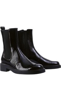 Stivaletti neri realizzati in pelle verniciata lucida, con pannelli laterali elasticizzati e chiusura con zip, dotati di una suola piatta e strutturata.