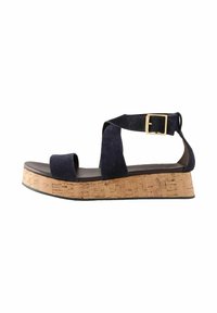 Sandale din suede bleumarin cu toc din plută. Prezintă două curele late peste degete și glezna, fixate cu un detaliu din metal auriu.