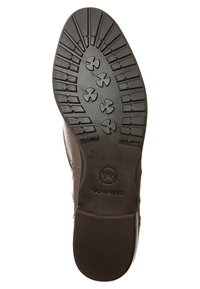 Semelle de chaussure en caoutchouc marron présentant un motif de bande de roulement avec des rainures circulaires et linéaires. Logo "Salamander" embossé sur le côté. Taille 7 visible.