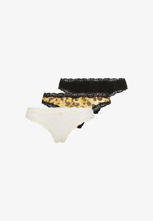 Tre par trusser: et hvide med blondedetaljer, et sorte med blondedetaljer og et leopardmønster, alle med lav talje design.