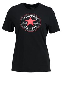 Svart bomulls T-shirt med en röd stjärngrafik omgiven av en cirkulär logotyp med texten "Converse Chuck Taylor All Star". Kortärmad.