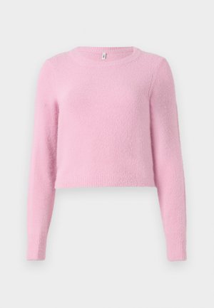 Roze cropped sweater met lange mouwen, gemaakt van zacht, pluizig materiaal. Heeft een ronde halslijn en geribde manchetten. Textuur oppervlak.