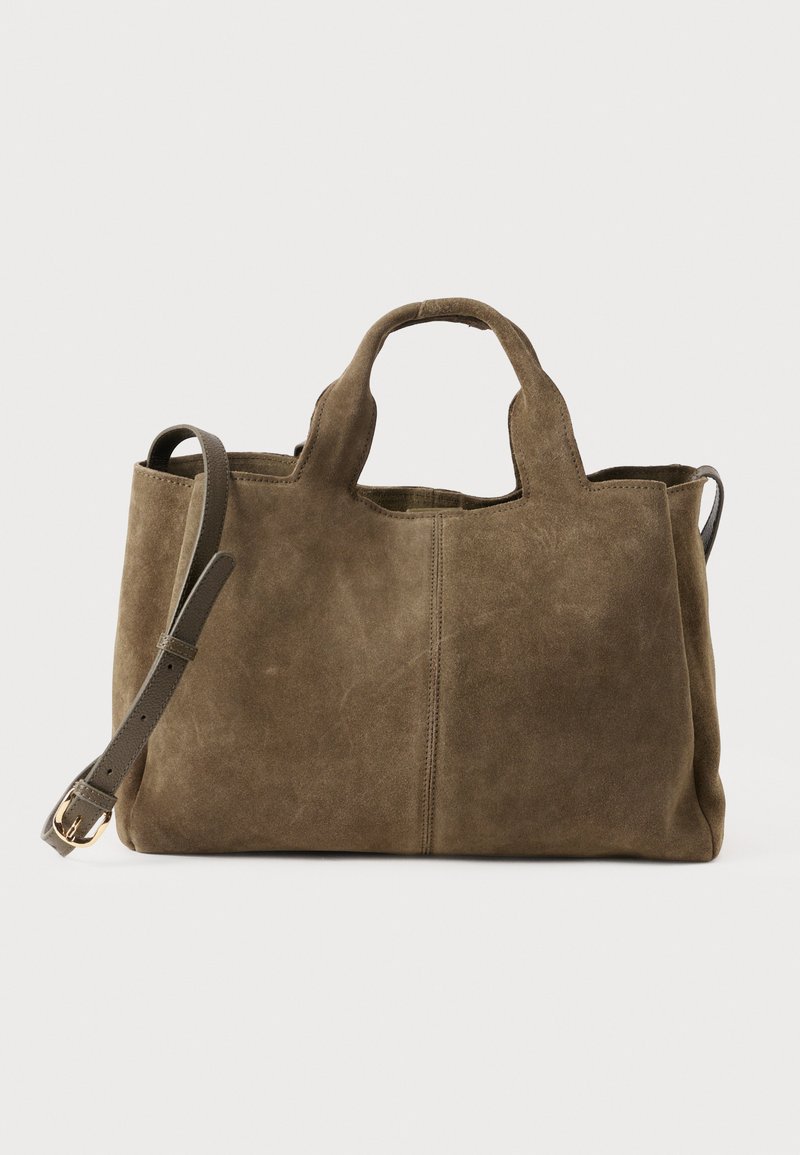 Brown suede handbag with short handles and detachable, adjustable strap with gold buckle on a white background.