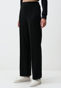 HIGH WAIST WIDE LEG SLIT COMFORTABLE - Jogginghose - black