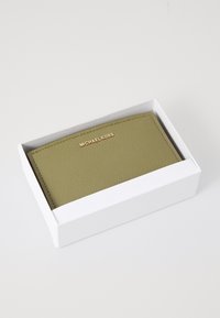 Olive green leather wallet featuring a textured surface, gold logo embossed on the front, presented in a white box.