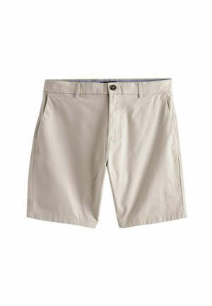 Shorts beige hechos de un tejido ligero, con cierre de botón, dos bolsillos laterales y un corte recto, con una textura suave y un diseño minimalista.