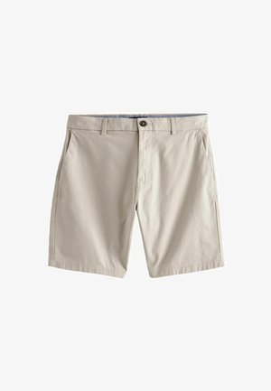 Beidza šorti, kas izgatavoti no viegla auduma, ar pogu aizdari, divām sānu kabatām un taisnu griezumu, ar gludu tekstūru un minimālu noformējumu.