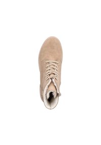 Botte beige en daim à lacets avec fermeture éclair latérale, montrant une doublure intérieure en fourrure blanche douce, vue de dessus sur fond blanc.