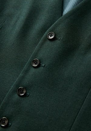 Dunkelgrünes Woll-Blazer mit vier schwarzen Knöpfen, taillierten Revers und glatter Textur mit dezenten Nähten.