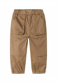 Kaki byxor med elastisk midja, två sidofickor, elastiska muddar och en slät tygtextur; tapered design med avslappnad passform.