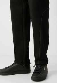 HUGO NIPIPEPANT - Tracksuit bottoms - black