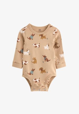 Langearmige romper in beige met hondenpatronen. Heeft drukknopen aan de onderkant, zachte katoen materiaal, en een ronde halslijn met contrasterende accenten.