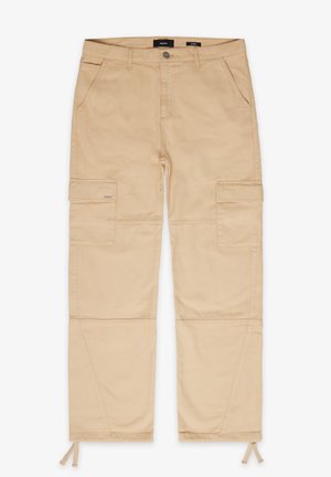 Pantalons cargo beiges avec deux poches avant et deux poches latérales. Présente des cordons élastiques aux chevilles et des détails de couture renforcée.