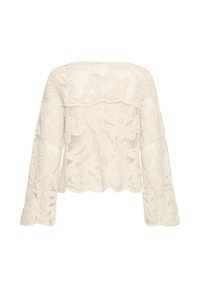 Top en dentelle crochet à manches longues couleur écrue avec motifs floraux, poignets légèrement évasés et bords festonnés à l'ourlet et à l'encolure.