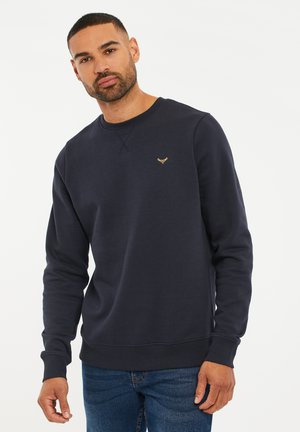 Navyblauwe sweatshirt in een katoenmix met een ronde halslijn, ribgebreide mouwen en onderrand, voorzien van een klein gouden logo op de borst.