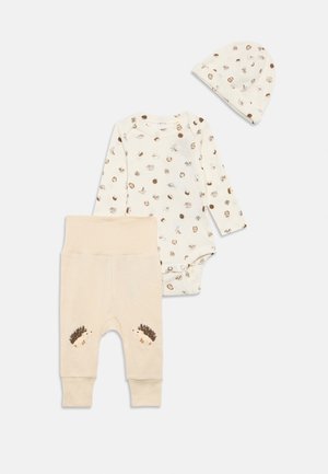 Cream baby outfit set with long-sleeve bodysuit and hat featuring small animal and plant prints, and pants with hedgehog illustrations on knees.