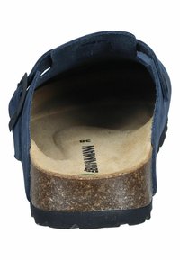 Dark blue leather sandal with a cork sole, featuring a textured footbed and an adjustable strap for fit. Back view highlights construction details.