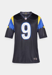 Μαύρη φανέλα NFL με κοντά μανίκια, μπλε και κίτρινες λεπτομέρειες, με μεγάλο λευκό αριθμό 9 στο μπροστινό μέρος και λογότυπα της ομάδας στο γιακά.
