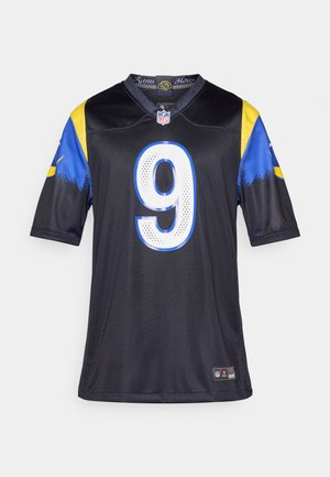 Melnas NFL džersija ar īsām piedurknēm, zilām un dzeltenām detaļām, priekšpusē ar lielu baltu ciparu 9 un komandas logo apkaklē.
