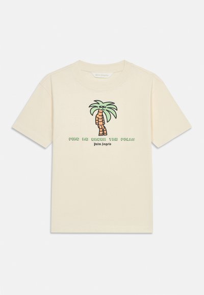 Beige short-sleeve t-shirt with a cartoon palm tree wearing sunglasses and text "Find Me Under The Palms" and "Palm Angels" on front.