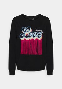 Svart sweatshirt med färgstark "Love"-text och rosa fransdetaljer längst ner. Långa ärmar med ribbade muddar. Mjuk tygkänsla.