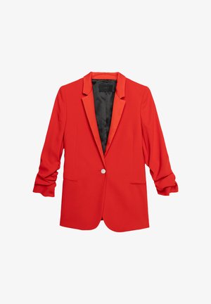 Blazer rouge avec un seul bouton en métal argenté, revers crantés et manches retroussées. Fabriqué dans un tissu lisse, doté d'une doublure intérieure noire et de poches latérales.