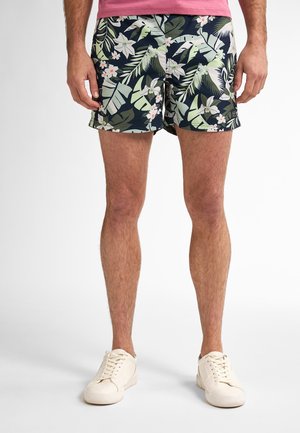 Zwemshorts met bloemenpatroon, met groene bladeren en witte bloemen op een marineblauwe achtergrond, met een relaxte fit en een standaard tailleband.