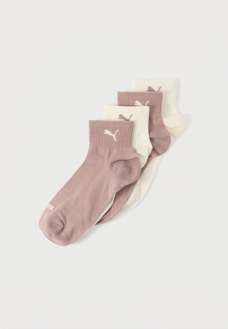 Four folded ankle socks in alternating light pink and cream colors with a Puma logo on the cuffs, arranged on a white background.