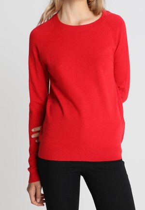 Red knitted sweater with a round neckline, long sleeves, ribbed cuffs and hem. Smooth texture, fitted design, and minimalistic look.