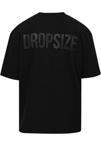 Sort bomulds T-shirt med korte ærmer og afslappet pasform. "DROPSIZE" trykt i fed, mat sort på ryggen.