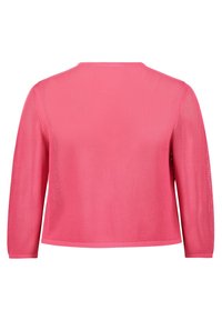 Light pink knit sweater with a textured mesh design, long sleeves, and a round neckline. The hem and cuffs are finished with solid ribbing.