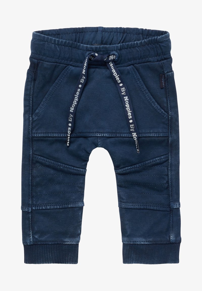 Pantalon bleu marine en mélange de coton avec une taille élastique, un cordon de serrage, des poches latérales et des détails de couture sur les jambes. Texture douce.