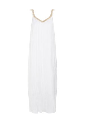 Robe maxi blanche sans manches avec bordure tressée dorée et pompons le long de l'encolure en V et des bretelles.