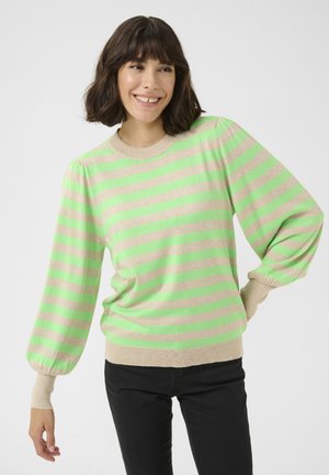 Light beige sweater with vibrant green horizontal stripes, featuring puffed sleeves and a ribbed neckline. Paired with black pants.