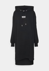 Schwarzes, übergroßes Hoodie-Kleid aus Baumwollmischung mit einer Fronttasche, Kordelzugkapuze und einem weißen Logo-Design auf der Brust.