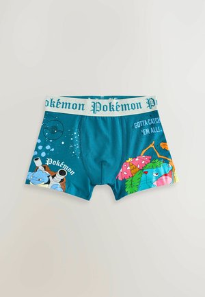 Teal bomullskalsonger med Pokémon-tryck. Har karaktärer som Blastoise och Venusaur, samt en vit midjeresår med texten "Pokémon".