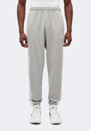 adidas Sportswear, ESSENTIALS 3 STRIPES TAPERED CUFFED PANTS - Pantalon de survêtement - medium grey heather