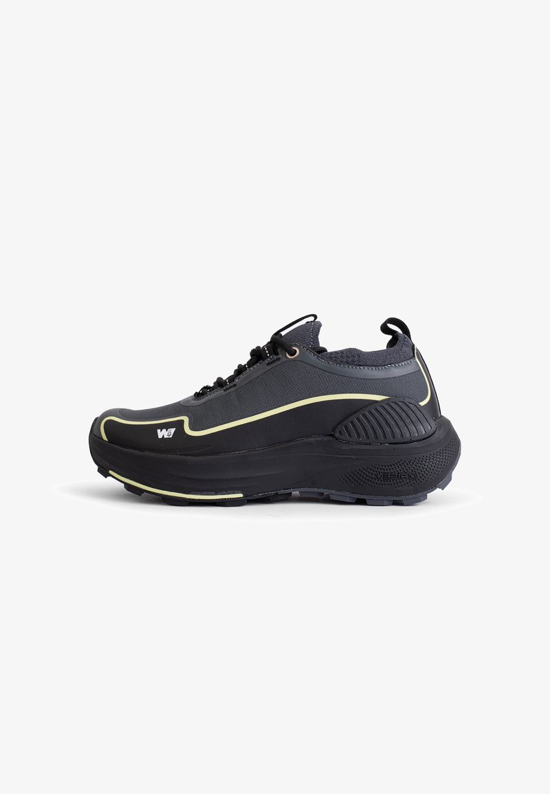 Black athletic shoe with a textured upper, reinforced toe cap, and rubber sole. Features a yellow outline and adjustable laces for fit.
