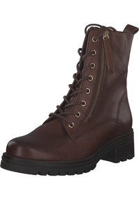 Bottine en cuir marron avec un bout rond, un lacet à l'avant, une fermeture éclair sur le côté, des détails en métal doré et une semelle noire épaisse avec des crampons.