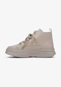 High-top sneakers made of smooth beige leather with round toe, lace-up front, and textured rubber sole with a ridged pattern.