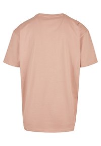 Short-sleeve, pink cotton T-shirt with a relaxed fit, crew neckline, and minimal stitching detail on the hem and sleeves.