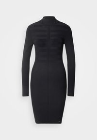 Robe noire en maille côtelée avec manches longues, col montant et design texturé à rayures verticales. Silhouette ajustée s'étendant jusqu'aux genoux.