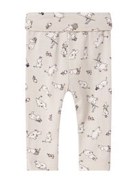 Vaaleanbeige leggingit, joissa on koko pinnan peittävä kuvio leikkisistä hahmoista mustalla ääriviivalla. Ne ovat pehmeää ja joustavaa kangasta, ja niissä on taitettava vyötärö.