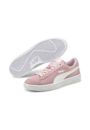 Pink suede sneakers with white rubber soles and side stripe, featuring tonal laces and a textured, herringbone outsole pattern.