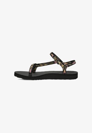 Chanclas negras con suelas de goma texturizada y correas anchas de tela con diseños florales en tonos rosa y verde.