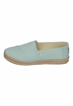 Light mint green slip-on espadrille shoe with a textured fabric upper, jute rope sole, and minimalistic design.